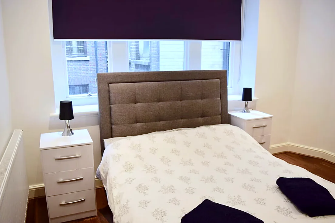 Double bedroom with padded headboard
