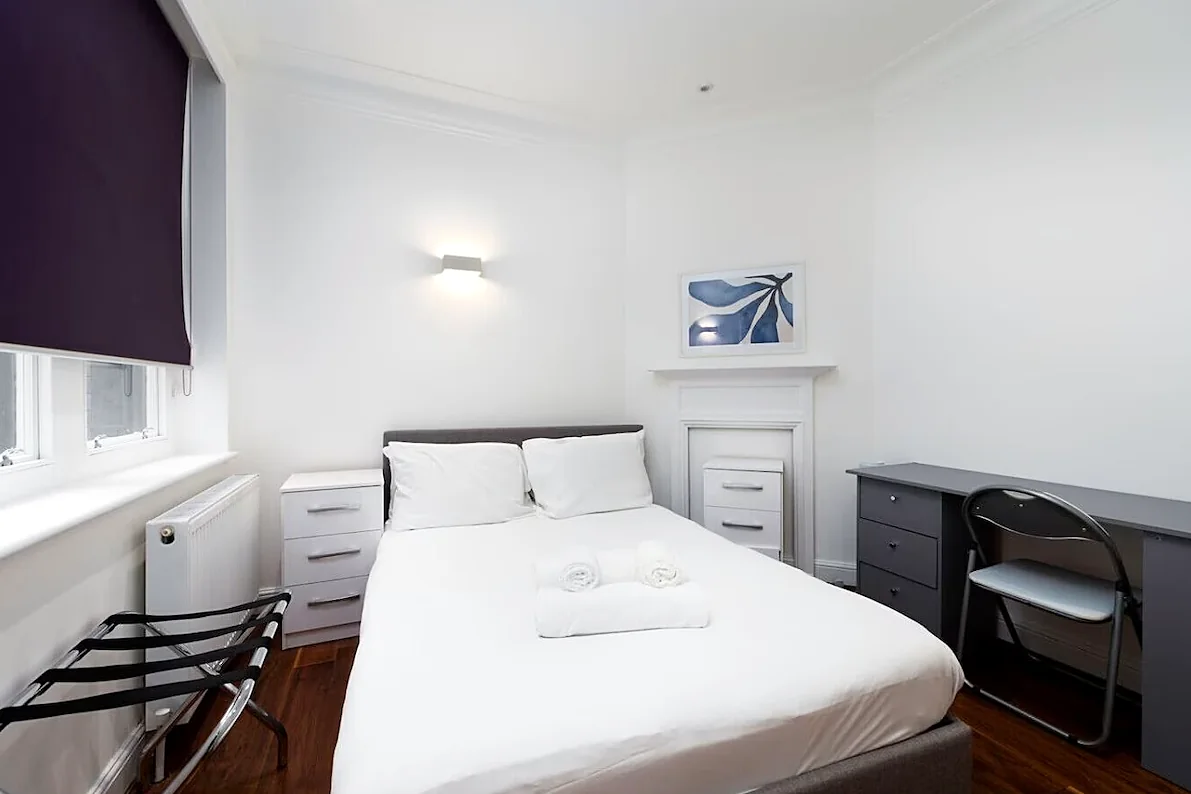 Bedroom with desk and bedside tables