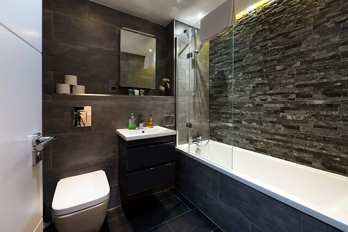 Bathroom with bath and shower