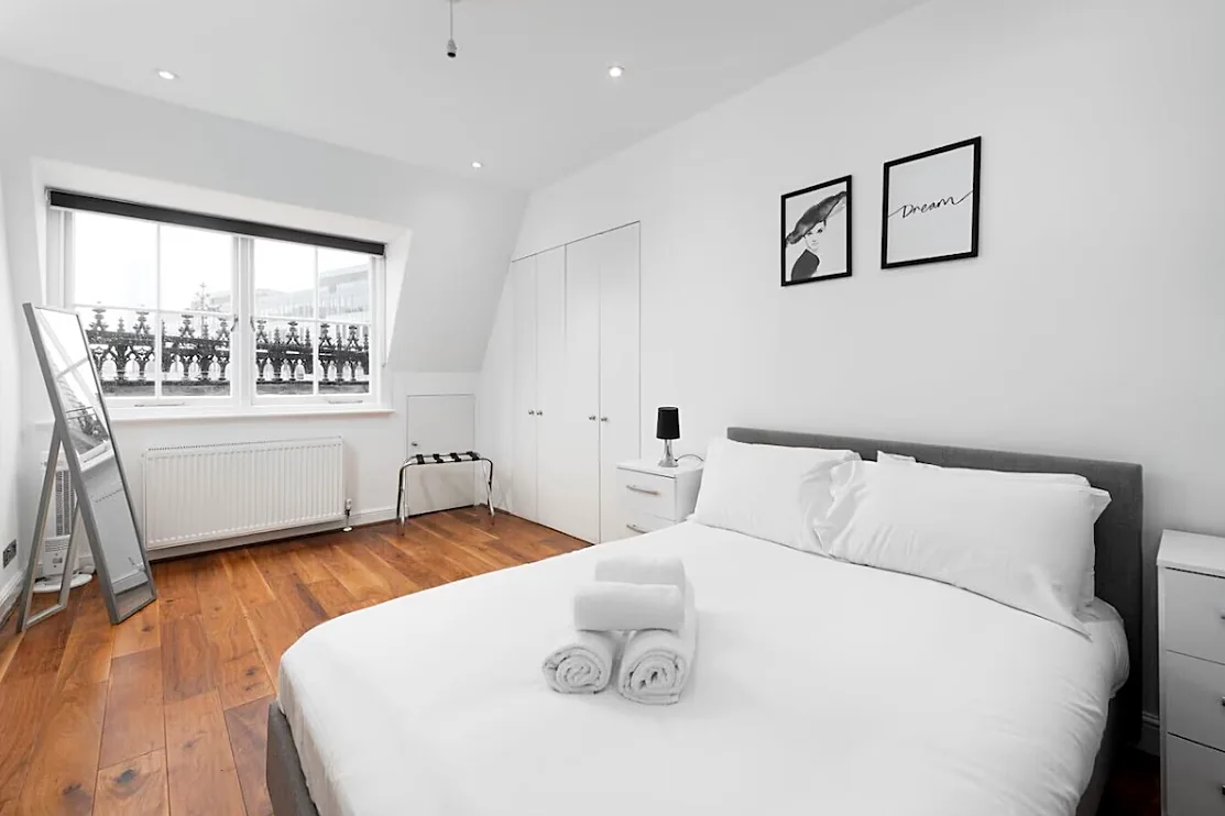 Bedroom with wardrobe and window