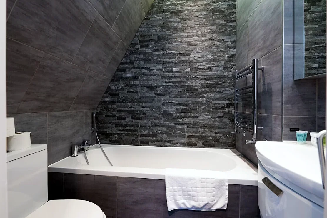 Bathroom with bath under the eaves