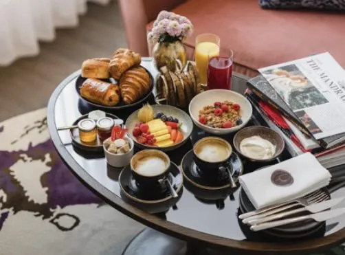 Brunch with pastries, fruit and coffee